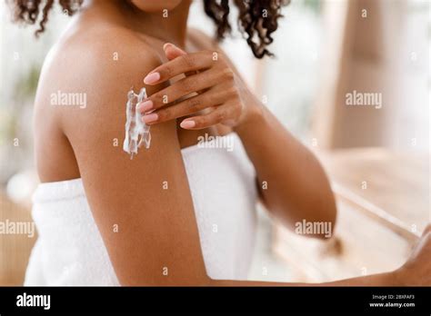 African American Woman Applying Lotion Hi Res Stock Photography And Images Alamy