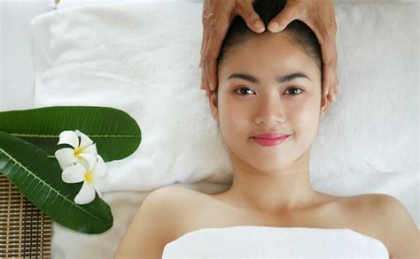 Premium Photo Relaxing Beautiful Asian Woman Having A Massage Skin On A Face In Spa Salon