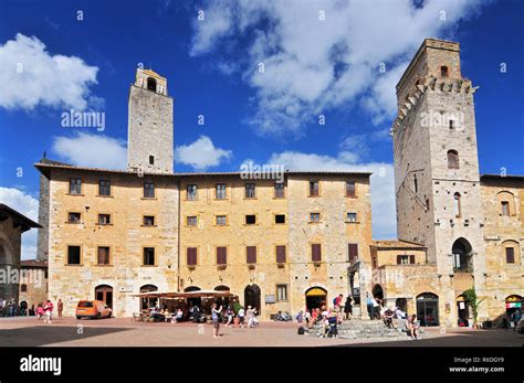 historic towers and public cistern piazza della cisterna san gimignano tuscany italy stock