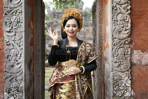 Woman Wearing Traditional Balinese Dress With Okay Gesture Stock Photo