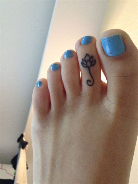 Keith haring dog tattoos on under big toe. Lotus flower toe tattoo: my latest | Toe tattoos, Finger ...