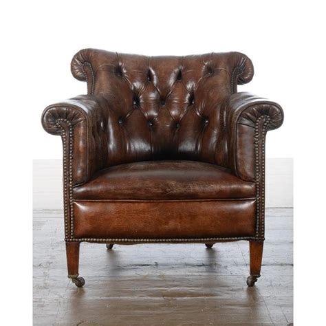 These large, cushioned chairs usually come in leather, adding a luxury layer of relaxation to any household. Chesterfield Tufted Leather Club Chair | Chairish