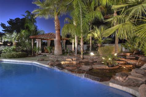 pool landscaping with palm trees - Tianna Minton