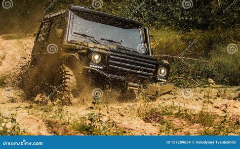 Off Road Vehicle Goes On The Mountain Bottom View To Big Offroad Car