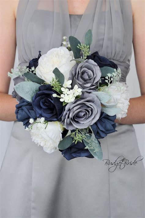 A Bridesmaid Holding A Bouquet Of Blue And White Flowers On Her Wedding Day
