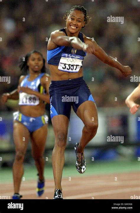 America S Marion Jones Celebrates Winning The Gold Medal In The Women S 100m Final At The
