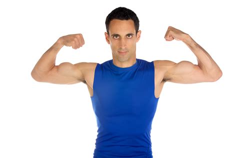 A Man Flexing His Muscles While Looking At The Camera