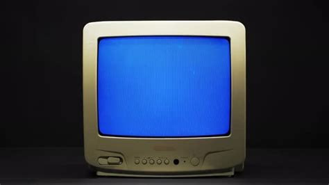 Old Retro Square Television With Blue Screen On Black Background Stock