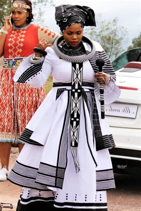 Usually worn over a bustier or a tank top, the dress consists of a wrapped skirt and a sash. Modern Xhosa Traditional Dresses Latest Designs - Sunika ...