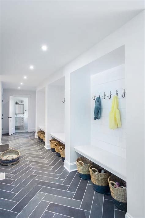 Long White And Gray Mudroom Is Fitted With Gray Slate Herringbone Floor