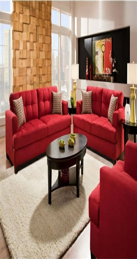 Retro living room interior with armchairs, sofa decorated with orange pillows, coffee table, poster, cupboard and patterned carpet. 85 Decorating Tips Wohnzimmer Gestalten Rote Couch ...