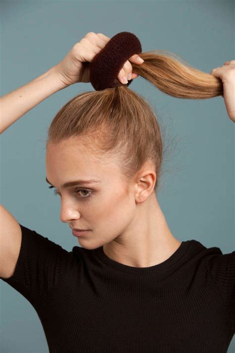 Tilt your head forward and fan out your hair over the donut. Tutorial: How to Make a Hair Donut Bun