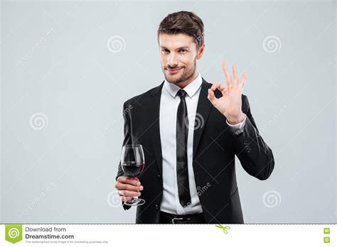 Free high resolution images man holding wine glass, alcohol, romance, male, man, party. Man Holding Glass Of Red Wine And Showing Ok Sign Stock ...