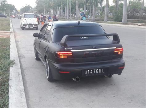 Penampakan mobil sedan timor modifikasi dilengkapi dengan kumis mr.black capunino hoha. sedan Timor DOHC modifikasi racing - MobilBekas.com