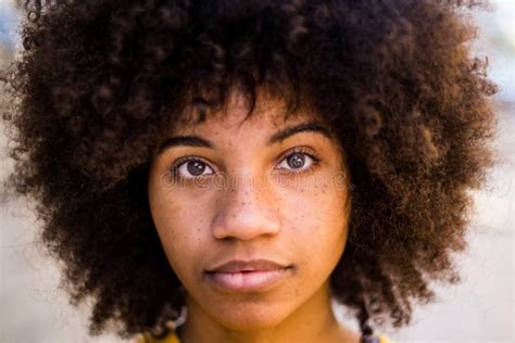 Portrait And Close Up Of Beautiful Young African Or American Woman Looking At The Camera Stock
