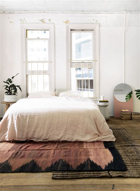Simple yellow and white rug to brighten up a bedroom. Layered Rugs - Honestly WTF