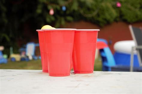 Premium Photo Beer Pong In Backyard During Summer