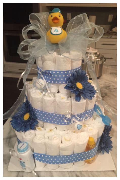 This is a baby shower game called nursery rhyme quiz. DIY Baby Shower party ideas! Diaper cake for centerpiece ...
