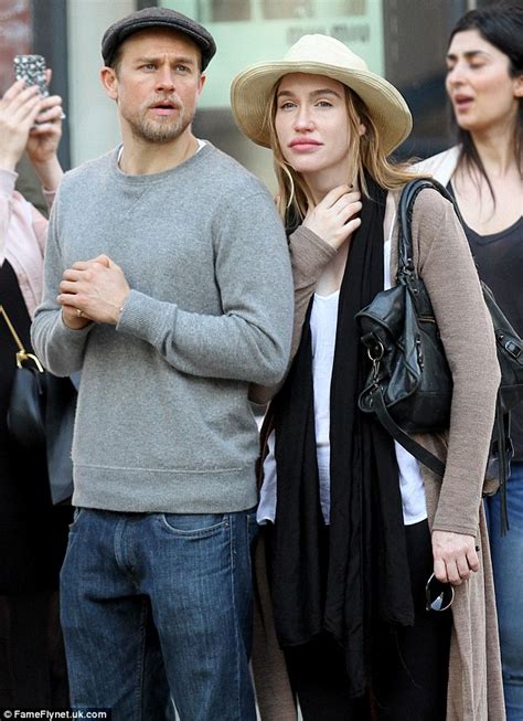 They met and started seeing each other around 2005, and have been going strong since. Charlie Hunnam cuts a rugged figure in casual outfit with ...