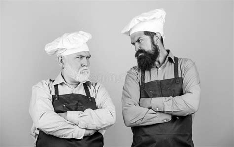 Commercial Kitchen Entrepreneur In His Modern Look Bearded Chef Or Waiter Wearing Red Apron