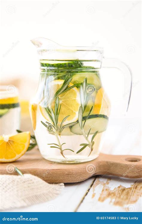 Lemon Cucumber And Rosemary Detox Water On Wooden Table Stock Image