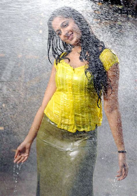 Indian Actress Anushka Shetty Hot Stills In Wet Yellow Dress Anushka