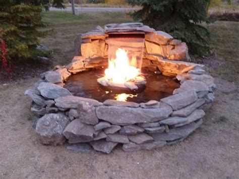 The perfect height to prop your feet on. fire pit waterfall combination | Fire pit with water ...