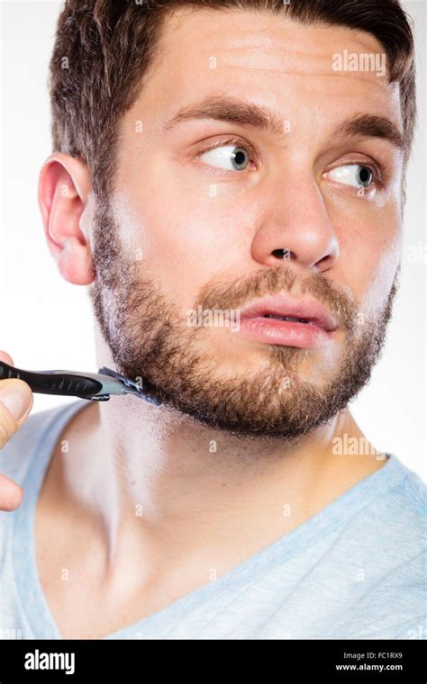 Young Man With Beard Holding Razor Blade Stock Photo Alamy
