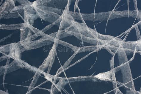 Matching vertical cracks are a sign of serious structural damage. Spider Web Of Tension Cracks In Thick Layer Of Ice Stock ...