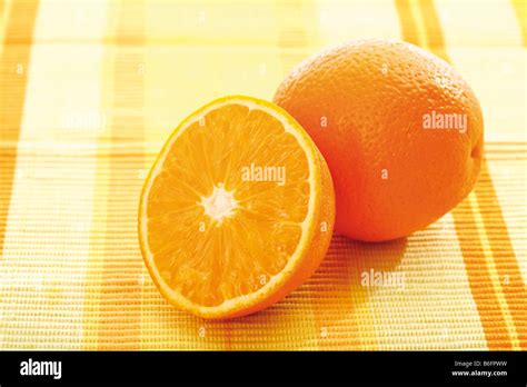 Halved And Whole Orange Stock Photo Alamy