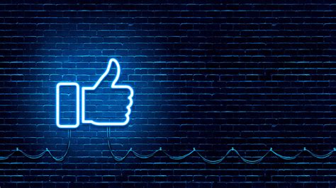 Neon Glowing Like Thumb Button For Social Media On Brick Wall Neon
