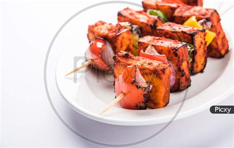 Image Of Chilli Paneer Tikka Kabab In Red Sauce Made In Barbeque Or