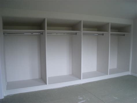 White painted MDF built-in wardrobes with frame and panel doors - DIY ...