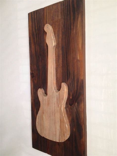 This is also a great wall idea for use behind your tv or fireplace. Electric Guitar Rustic Wood Wall Decor on Reclaimed Wood | Etsy | Rustic wood wall decor, Wood ...