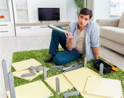 Man Assembling Furniture At Home Stock Photo Image Of Relocation