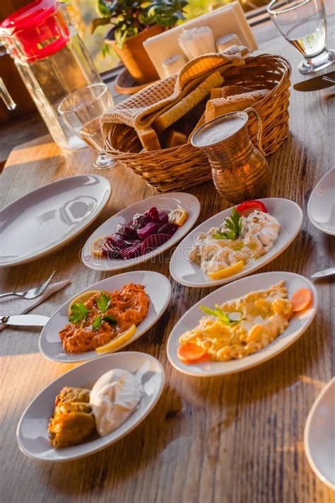 Traditional Turkish Appetizers On Table In Evening Sun Light And Ayran