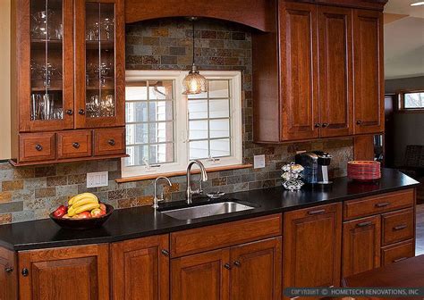 Points of interest ● grey and silver glass tile backsplash ● matte black cabinets ● waterfall kitchen island 13. Brown Gray SUBWAY SLATE BACKSPLASH Tile | Backsplash.com