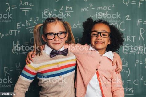 Young Retro Nerd Girls In Classroom Stock Photo Download Image Now