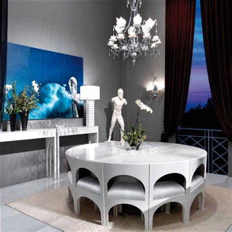 The george nelson buffet makes a beautiful instinct with life room center table that accommodates a couple of magazines straw even a pap tray. An Italian Dining Room with Colosseum-Inspired Table and ...