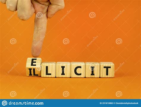 Illicit Or Elicit Symbol Businessman Turns Wooden Cubes And Changes