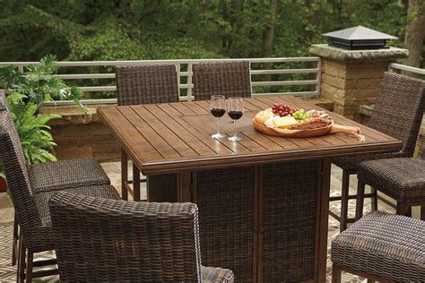 Dining table sets create wonderful opportunities for shared meals with family, group gatherings, and entertaining guests. Paradise Trail 9-Piece Outdoor Bar Table Set | Ashley ...