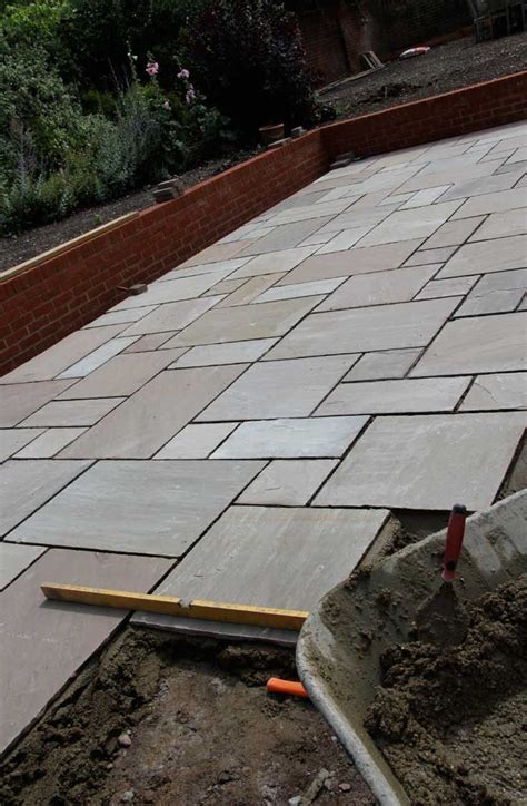 My husband is wanting to have a large area in our backyard concreted in the area of my son's basketball hoop. Raj Green sandstone slabs. http://www.dtstone.co.uk/raj ...