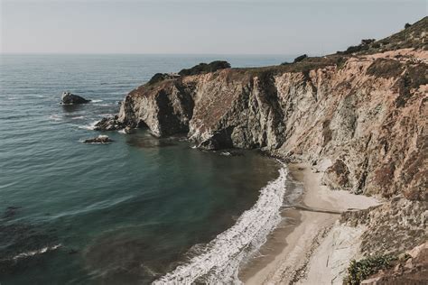 Photo Of Cliff Coast Near Seashore · Free Stock Photo