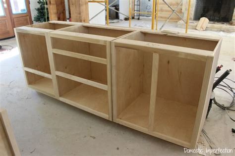 Use a table saw to cut plywood strips for your face frame cabinets. Cabinet Beginnings | Building kitchen cabinets, Diy cabinets