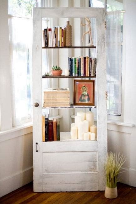 These shelving units were built to fit a cathedral ceiling; 25 Ways to Reuse and Recycle Wood Doors for Shelving Units ...