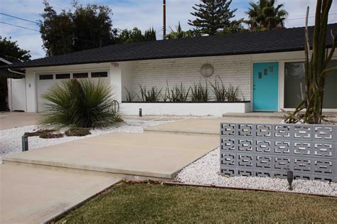 This house has great landscaping with a path to the front door and they have used real river rock. Mid Century Retro-Modern Ranch House Landscape