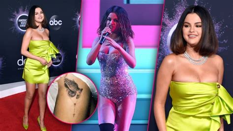 Gallery of selena gomez's tattoos that can be filtered by subject, body part and size. Selena Gomez: Thigh Tattoo & Neon Green Dress At 2019 AMAs