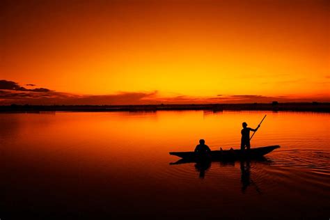 2 People On A Boat During Sunset · Free Stock Photo