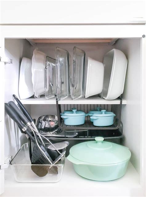Pick reasonable spots for plates, glasses, and mugs, and place all the parallel items together. How to Organize Kitchen Cabinets - Polished Habitat