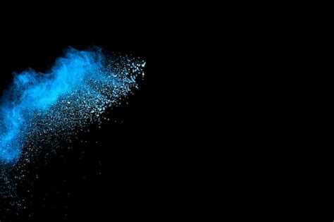 Premium Photo Abstract Blue Dust Explosion On Black Background